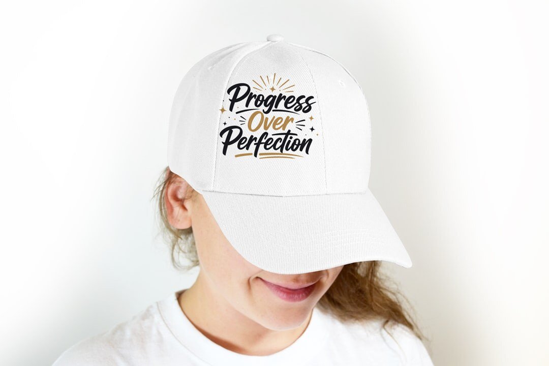 Progress Over Perfection - cap model mockup (woman-cap) Model wearing a baseball cap with the "Progress Over Perfection" design