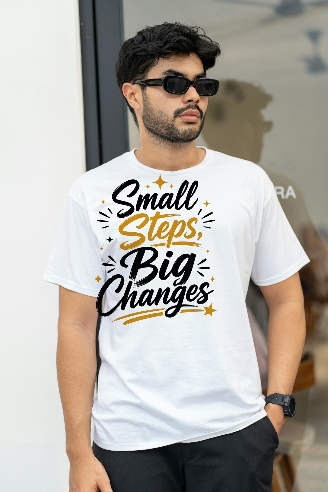 Small Steps, Big Changes - t-shirt model mockup (man-street) Model wearing a t-shirt with the "Small Steps, Big Changes" design