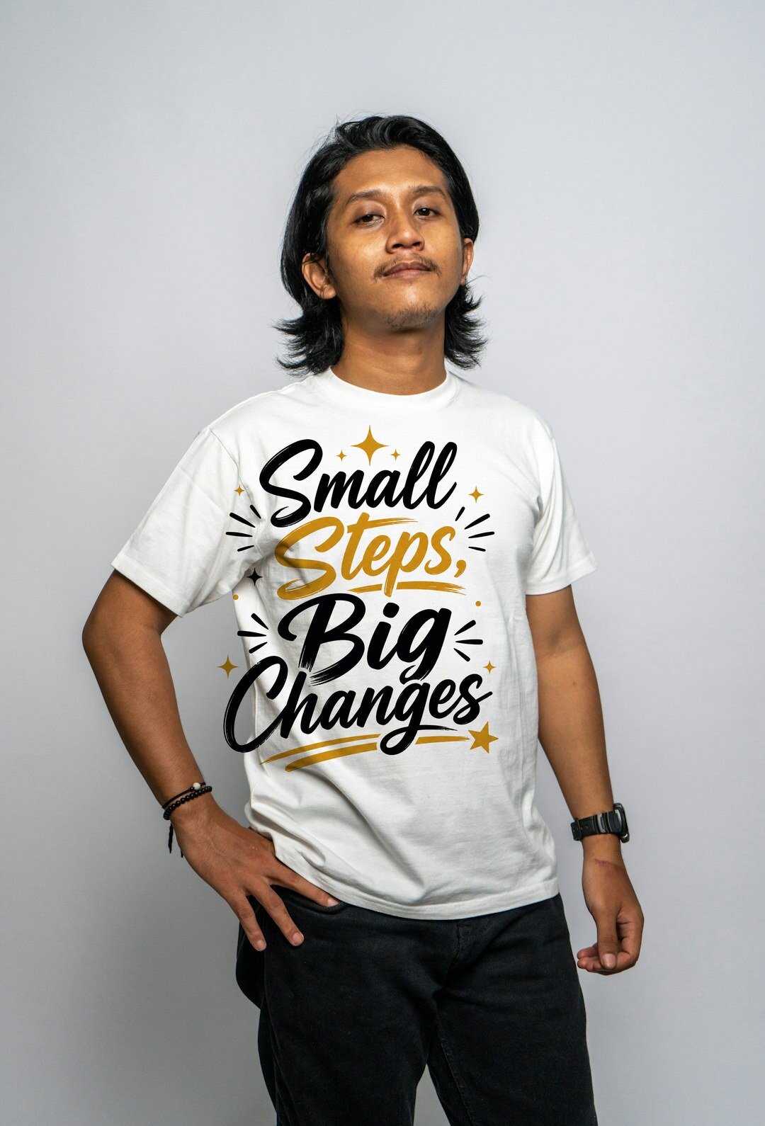 Small Steps, Big Changes - t-shirt model mockup (man-studio) Model wearing a t-shirt with the "Small Steps, Big Changes" design
