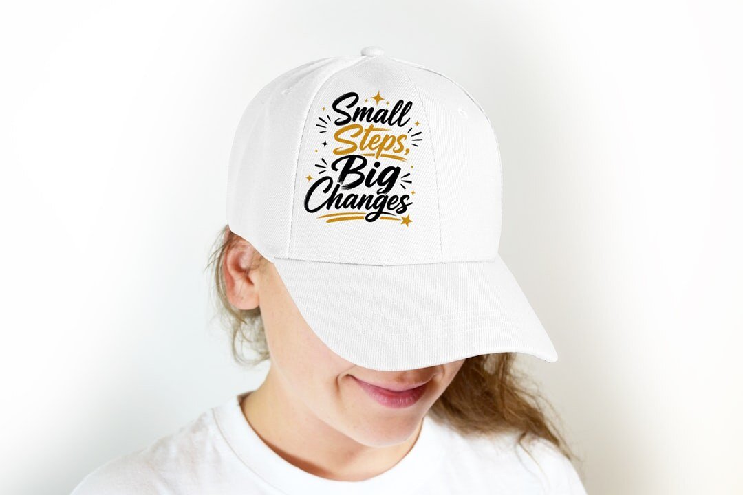 Small Steps, Big Changes - cap model mockup (woman-cap) Model wearing a baseball cap with the "Small Steps, Big Changes" design